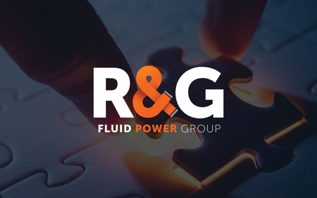 R&G fluid power group logo and text on navy background with a jigsaw piece